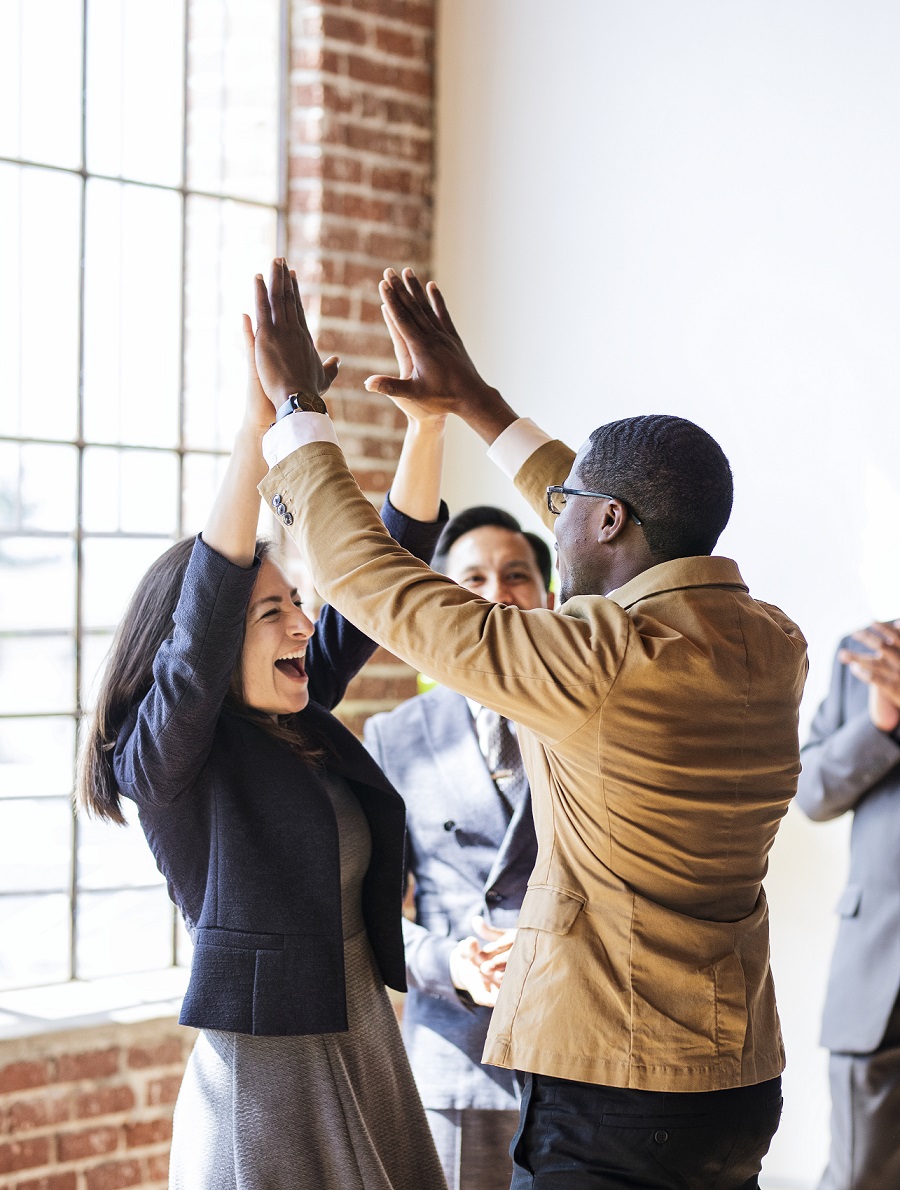 Business people doing a high five