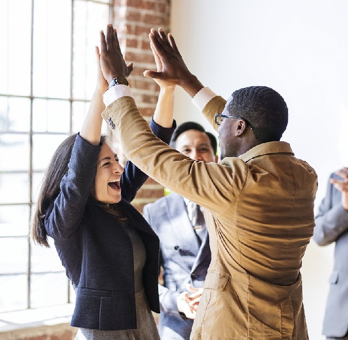 Business people doing a high five